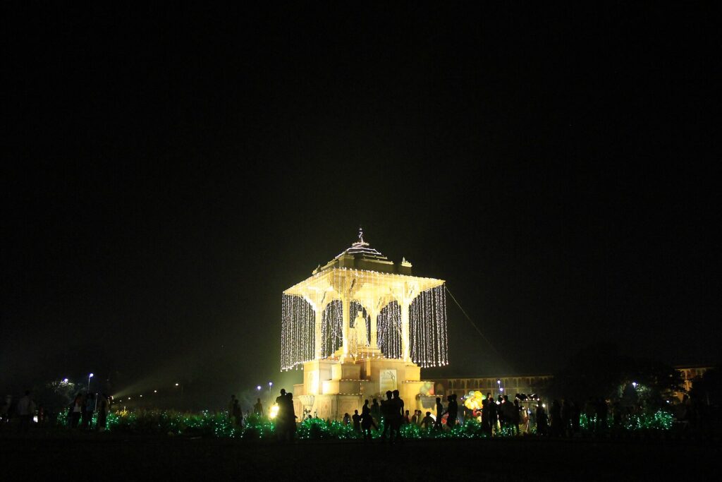 Night view of the white-marble Statue Circle monument illuminated in Jaipur
