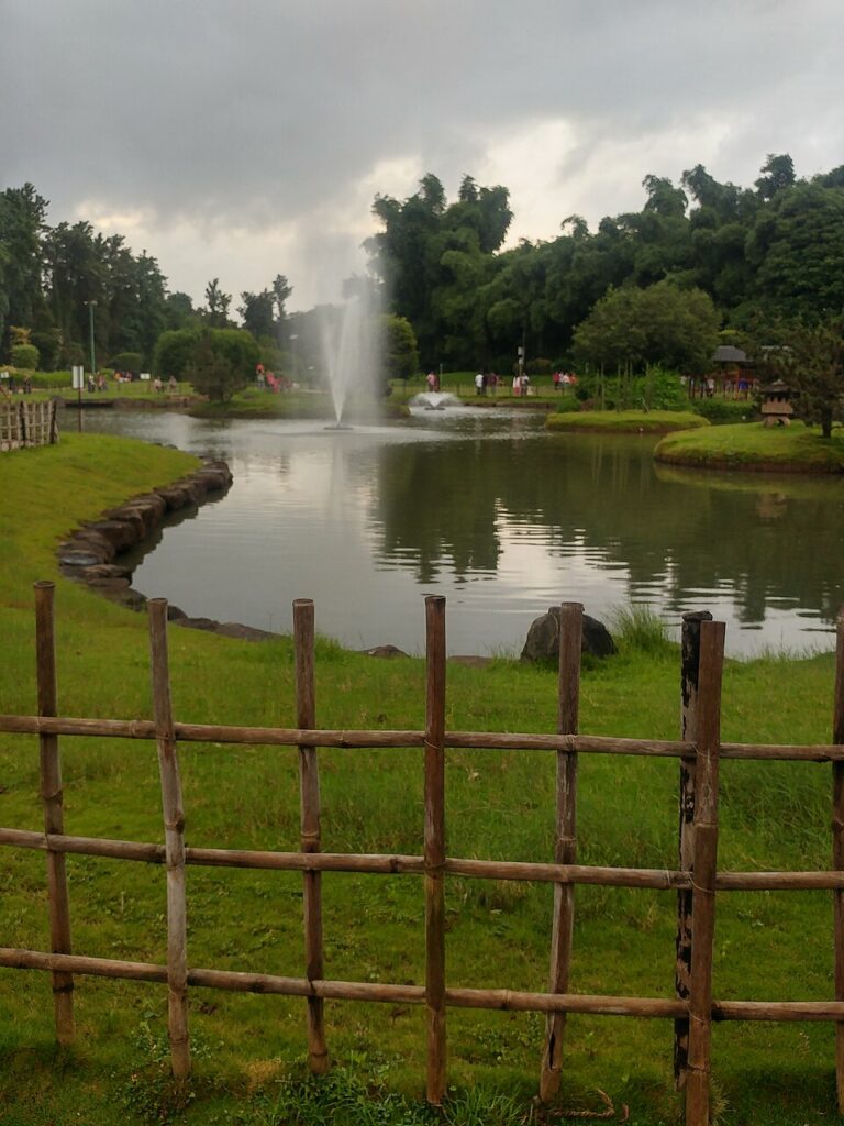 Landscaped path and greenery inside Pune-Okayama Friendship Garden.