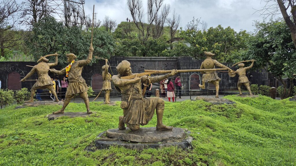 Sinhagad Fort overlooking green Sahyadri valleys near Pune.