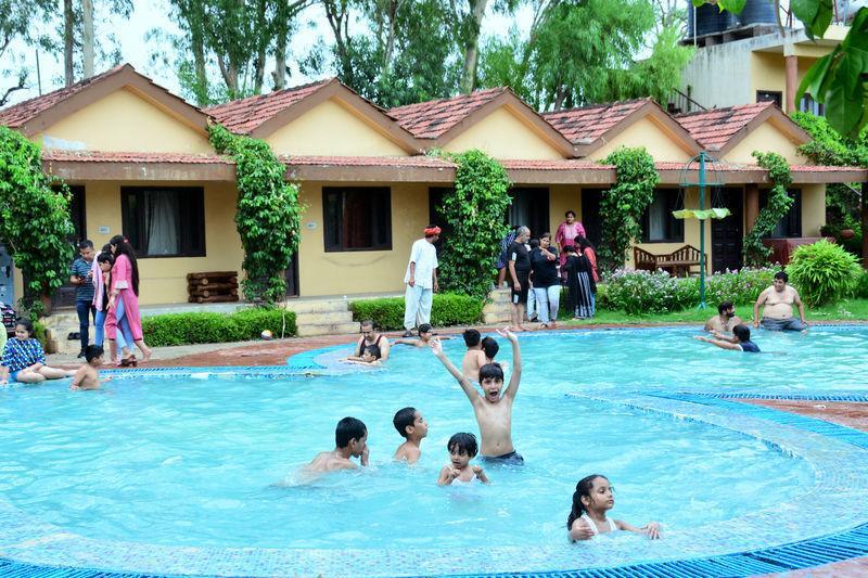 kids enjoying in resort with family