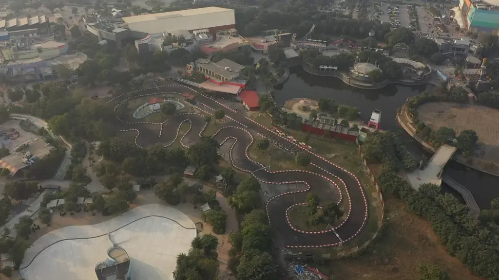 Drivers racing around a bend at Formula Karting delhi