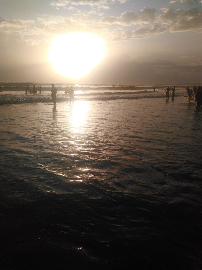 Family enjoying a sunset stay at a beach resort near Mumbai